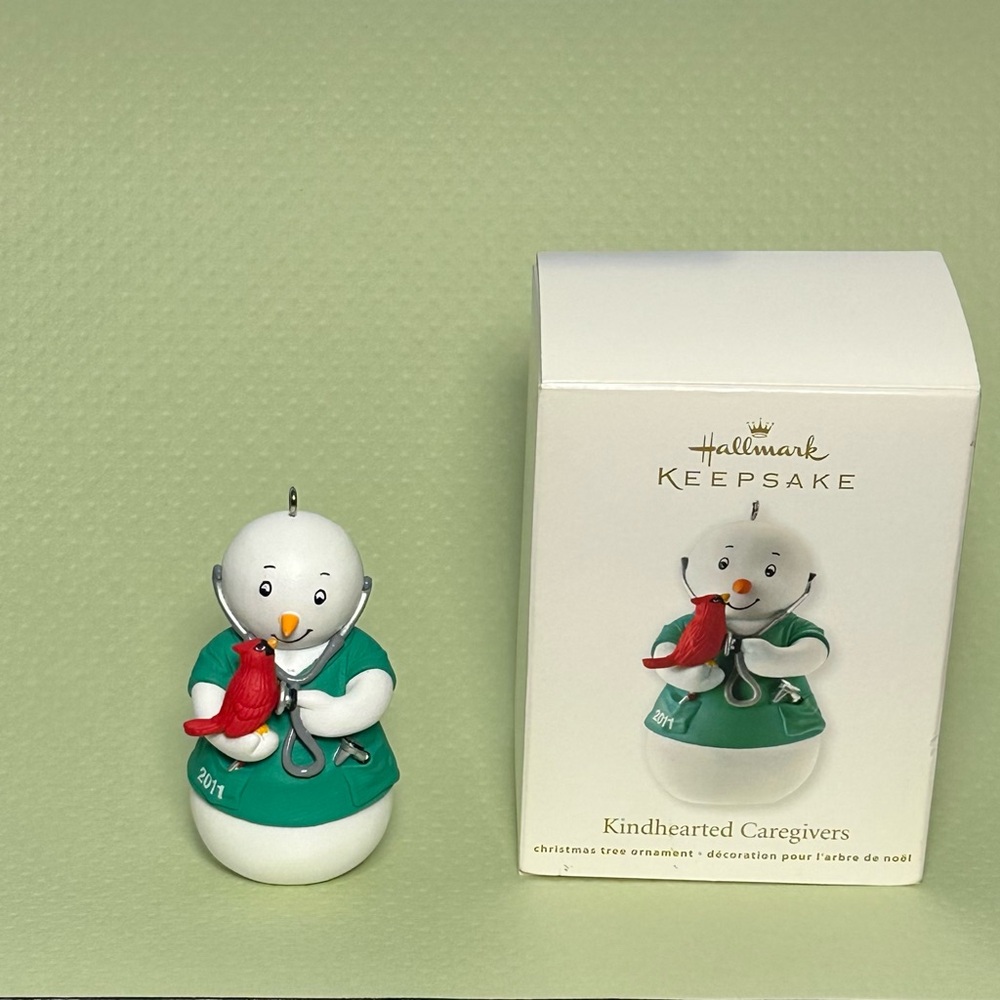 Hallmark Keepsake Snowman Kindhearted Caregiver Ornament with Red Bird 2011